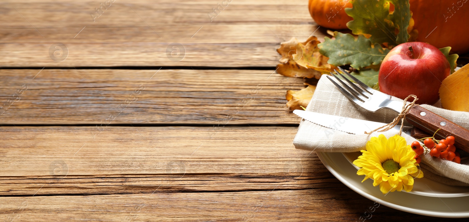 Image of Happy Thanksgiving Day, banner design. Festive table setting on wooden background, closeup with space for text