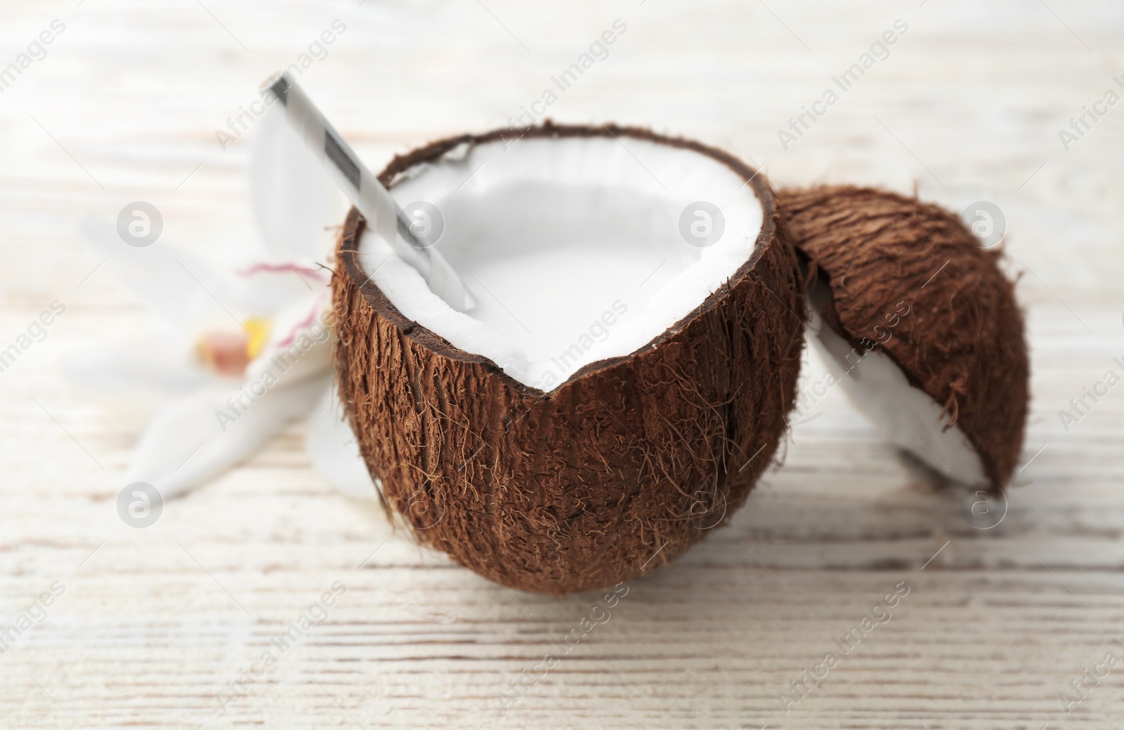 Photo of Nut with fresh coconut milk on wooden background