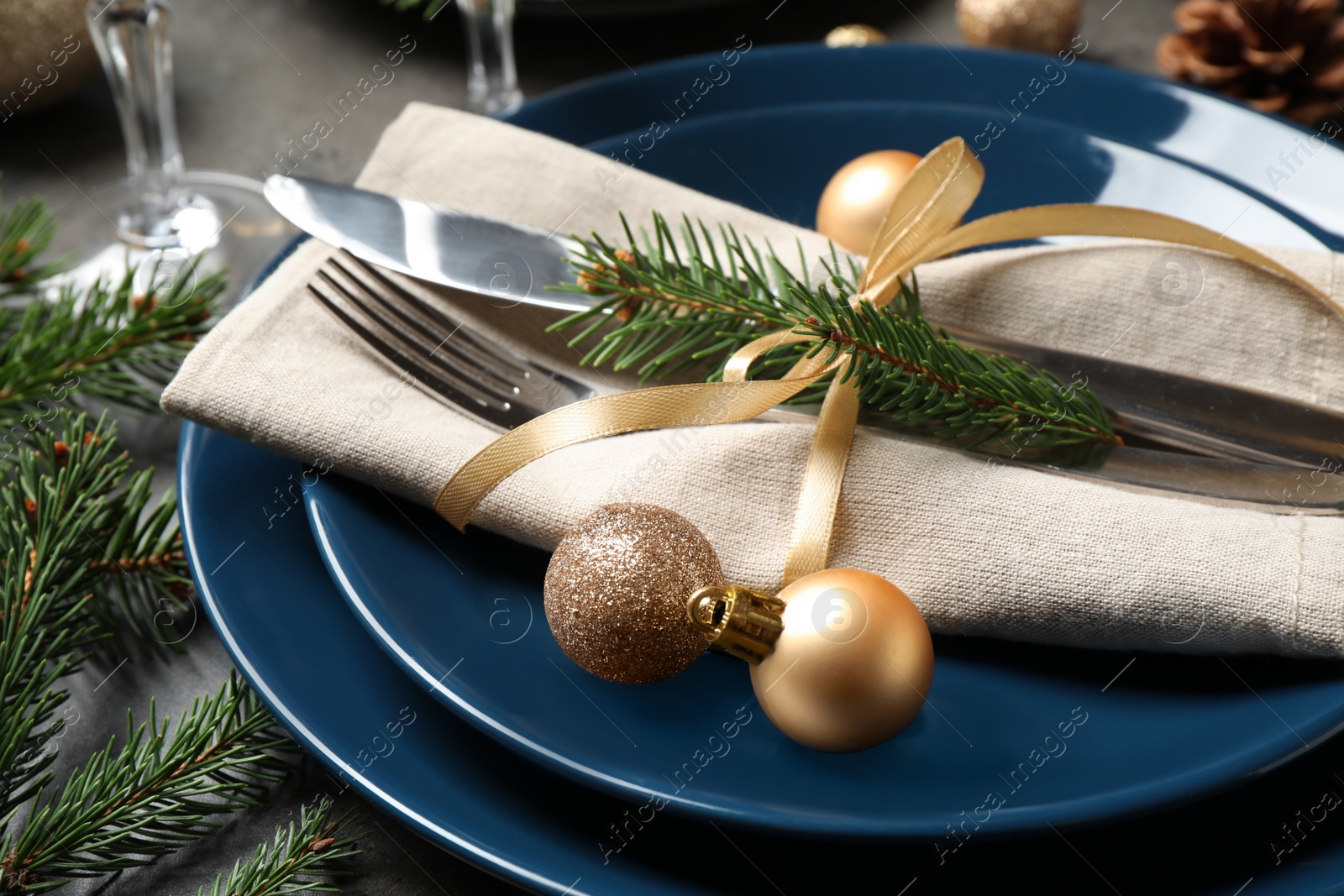 Photo of Festive table setting with beautiful dishware and Christmas decor, closeup