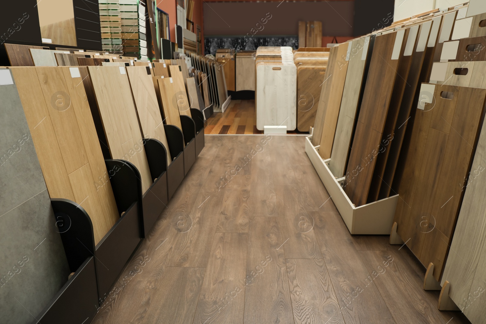 Photo of Many different samples of wooden flooring in store