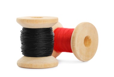 Different colorful sewing threads on white background, closeup