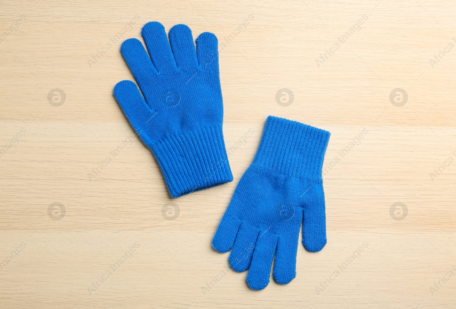 Photo of Stylish gloves on white wooden background, flat lay