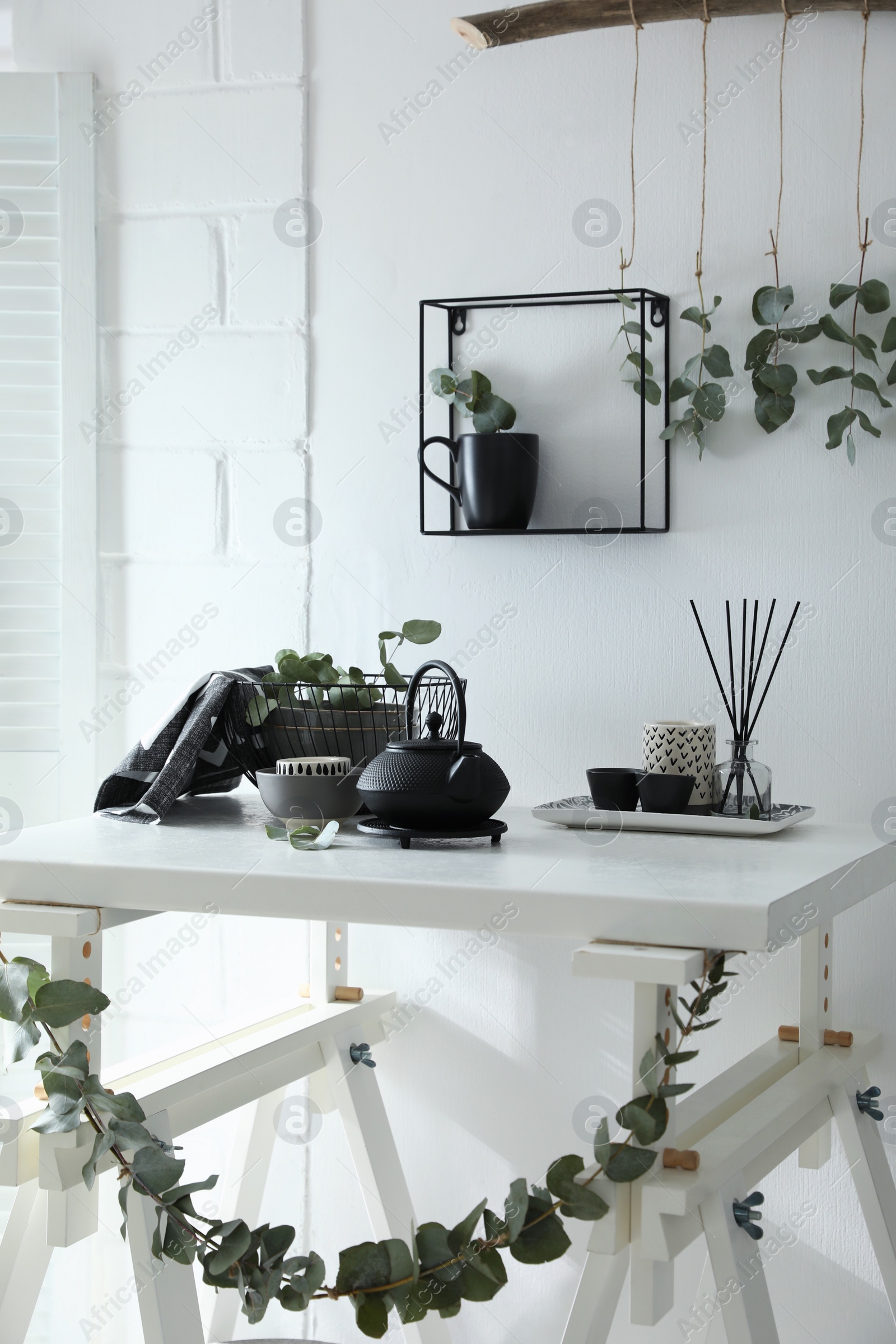 Photo of Stylish room decorated with beautiful green eucalyptus branches