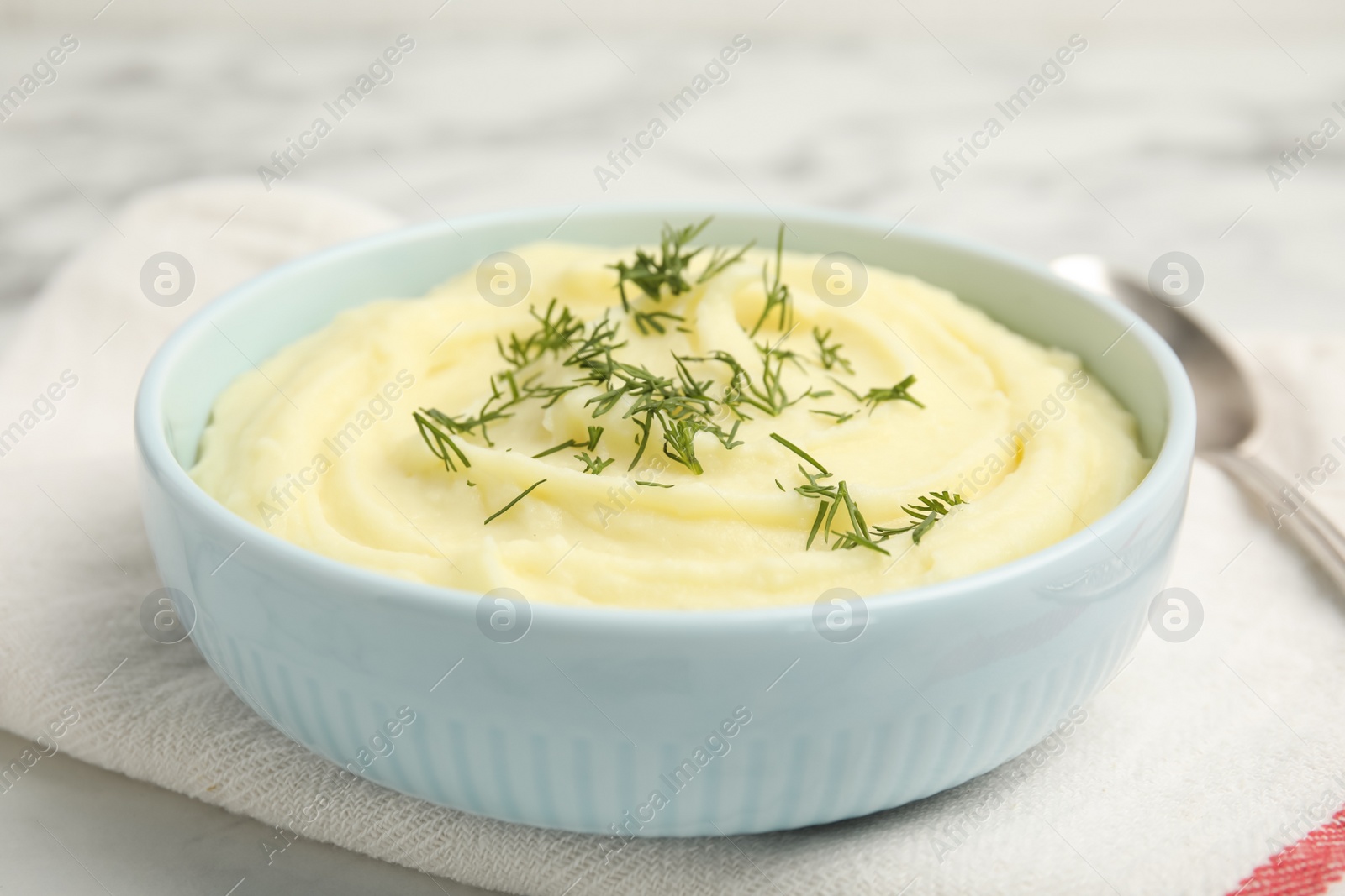 Photo of Freshly cooked homemade mashed potatoes on white table, closeup