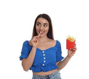 Photo of Beautiful young woman eating French fries on white background