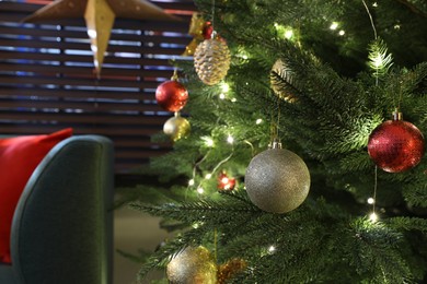 Photo of Beautifully decorated Christmas tree with baubles indoors, closeup. Space for text