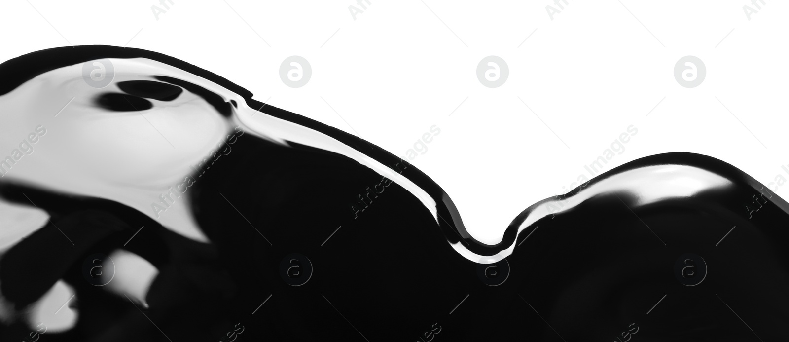 Photo of Black glossy paint spilled on white background, top view