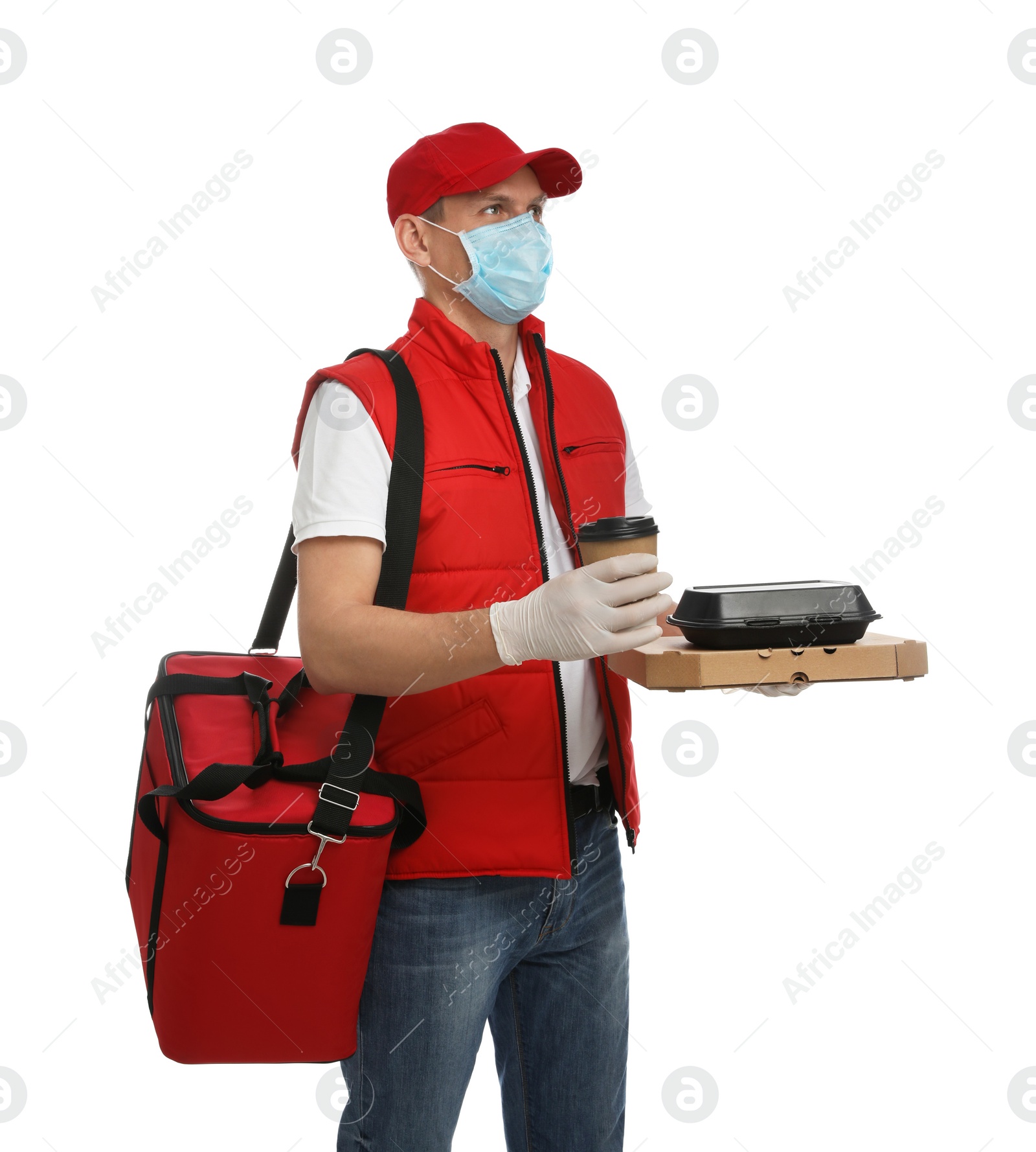 Photo of Courier in protective gloves and mask holding order on white background. Food delivery service during coronavirus quarantine