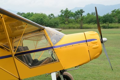 Photo of View of beautiful ultralight airplane in field on autumn day