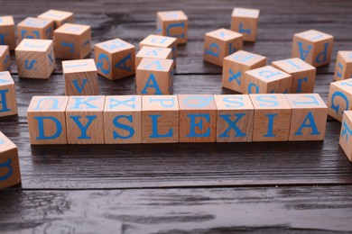 Cubes with word Dyslexia on wooden table