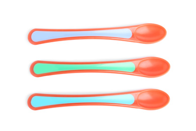 Colorful plastic spoons isolated on white, top view. Serving baby food