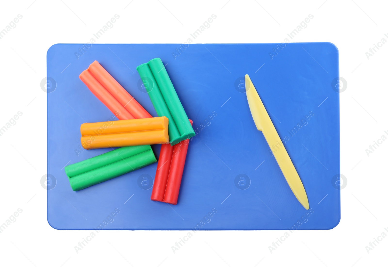 Photo of Many different colorful plasticine pieces and sculpting knife on white background, top view