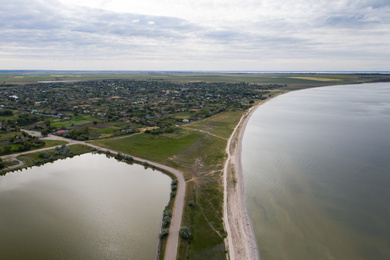 Image of Beautiful aerial view of spit in river on cloudy day