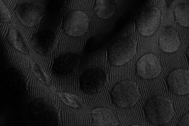 Photo of Textured black fabric as background, closeup view