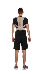 Man with orthopedic corset on white background, back view
