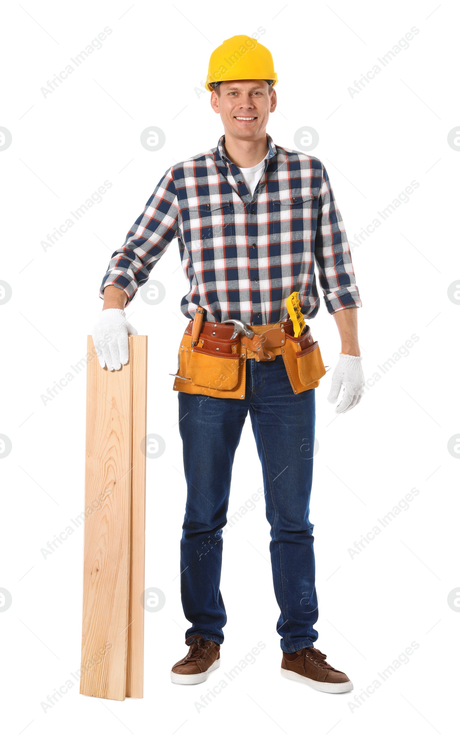 Photo of Handsome carpenter with wooden planks isolated on white