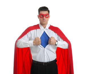 Businessman in superhero cape and mask taking shirt off on white background