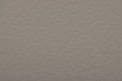 Texture of light grey paper sheet as background, top view