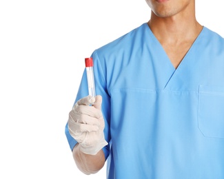 Male doctor holding empty test tube on white background, closeup. Medical object