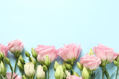 Photo of Happy Mother's Day. Beautiful roses on light blue background, flat lay. Space for text