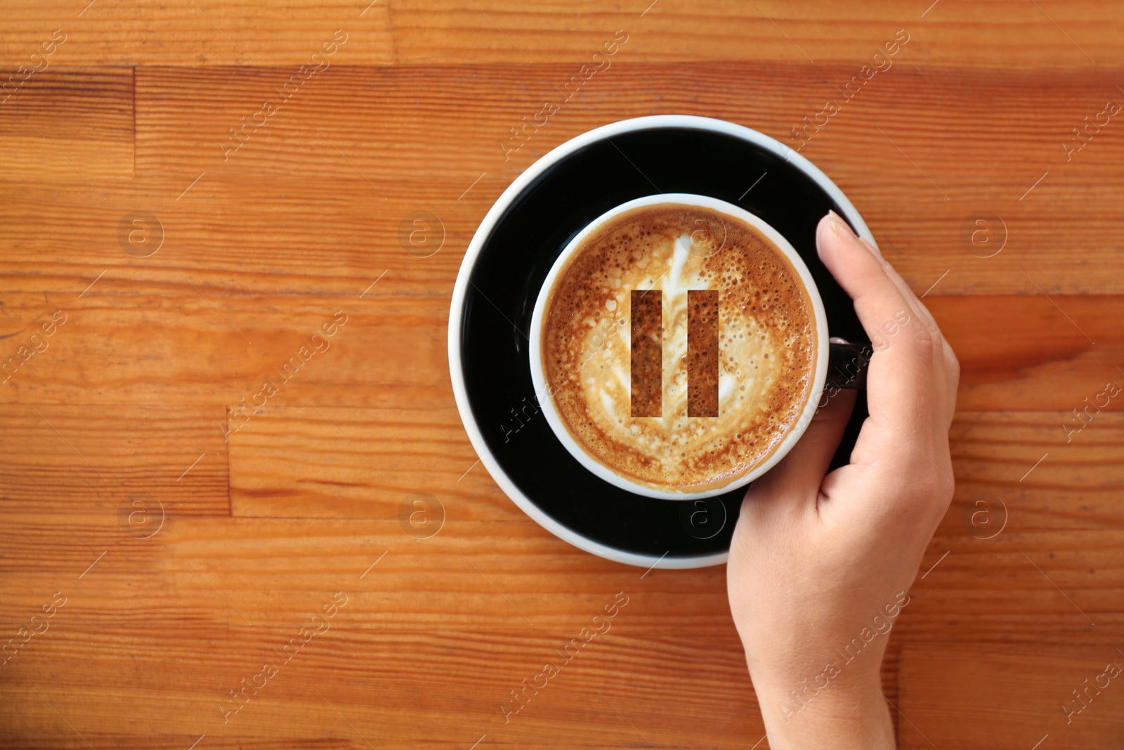 Image of Coffee Break. Woman with cup of cappuccino at wooden table, top view