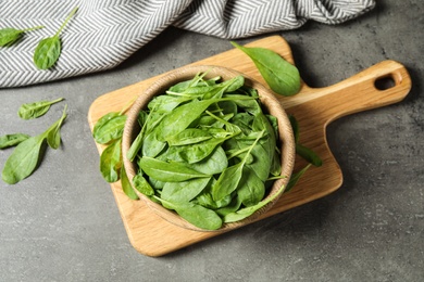 Fresh green healthy spinach on grey table, flat lay