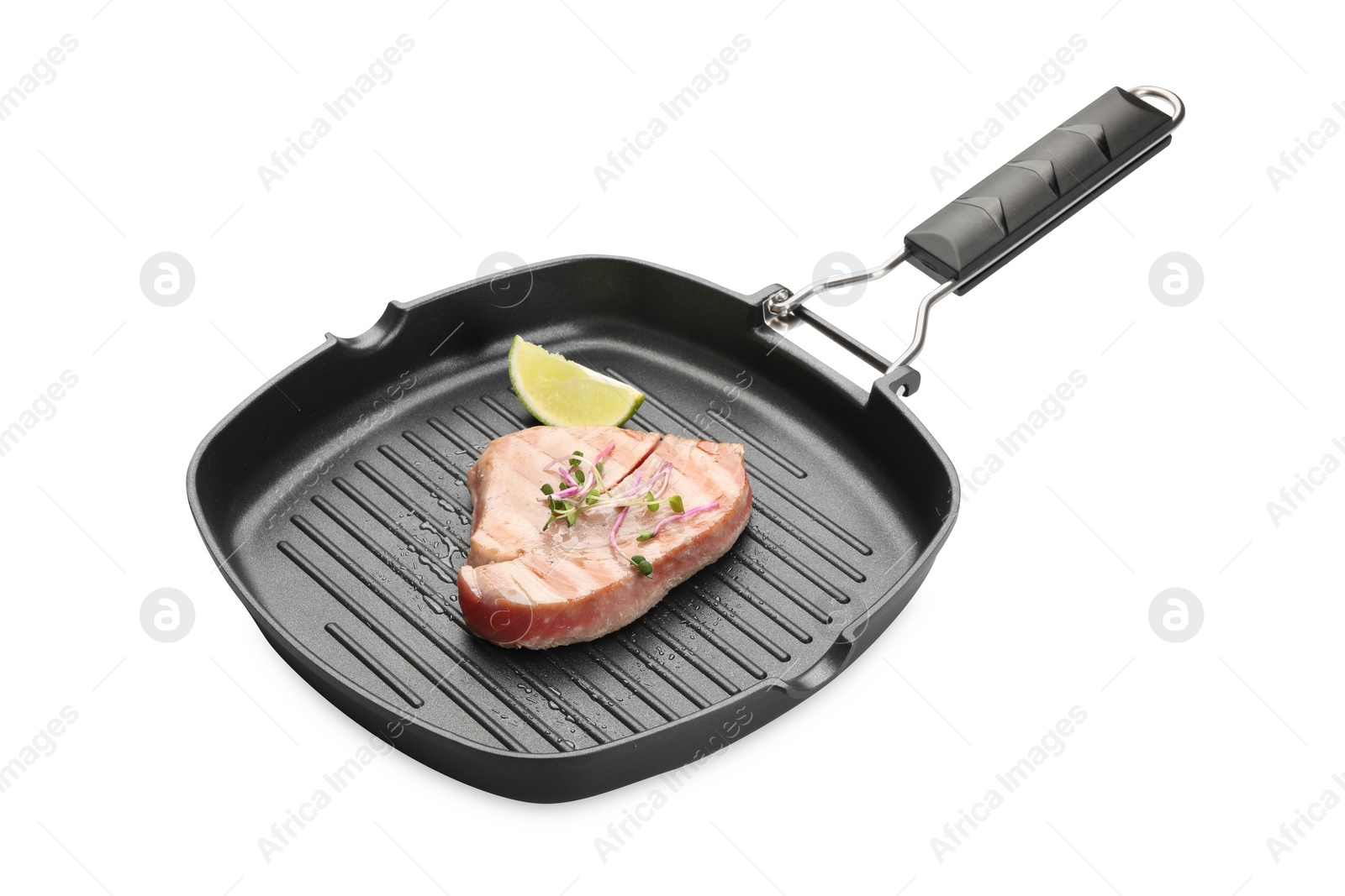 Photo of Delicious tuna steak with lime in grill pan on white background