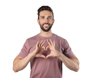 Photo of Happy man making heart with hands on white background