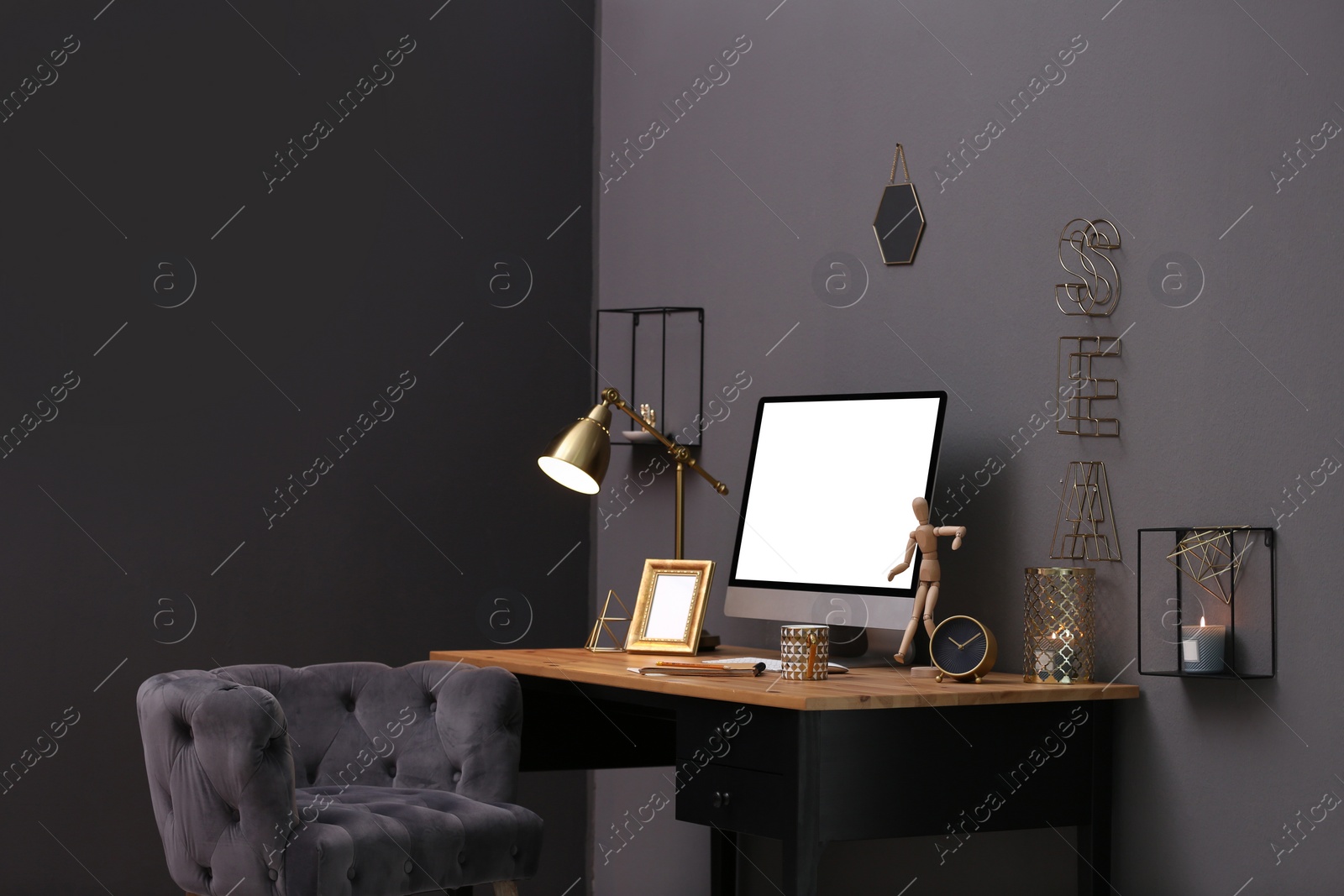 Photo of Modern computer on table in stylish office interior