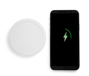 Photo of Wireless charger and smartphone isolated on white, top view