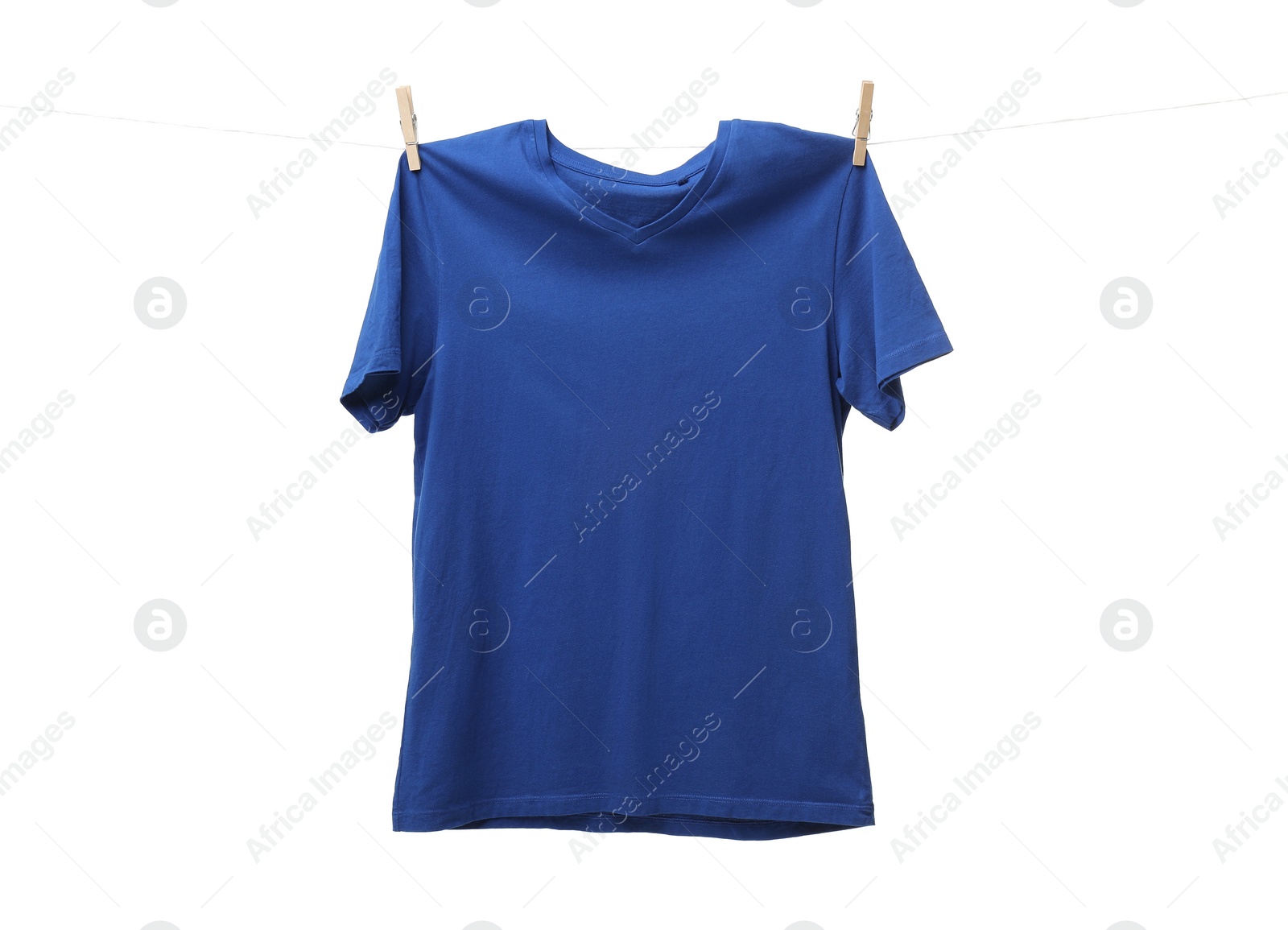 Photo of One blue t-shirt drying on washing line isolated on white