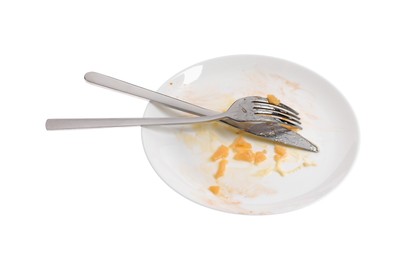 Dirty plate and cutlery on white background