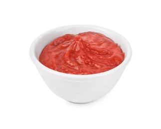 Photo of Organic ketchup in bowl isolated on white. Tomato sauce