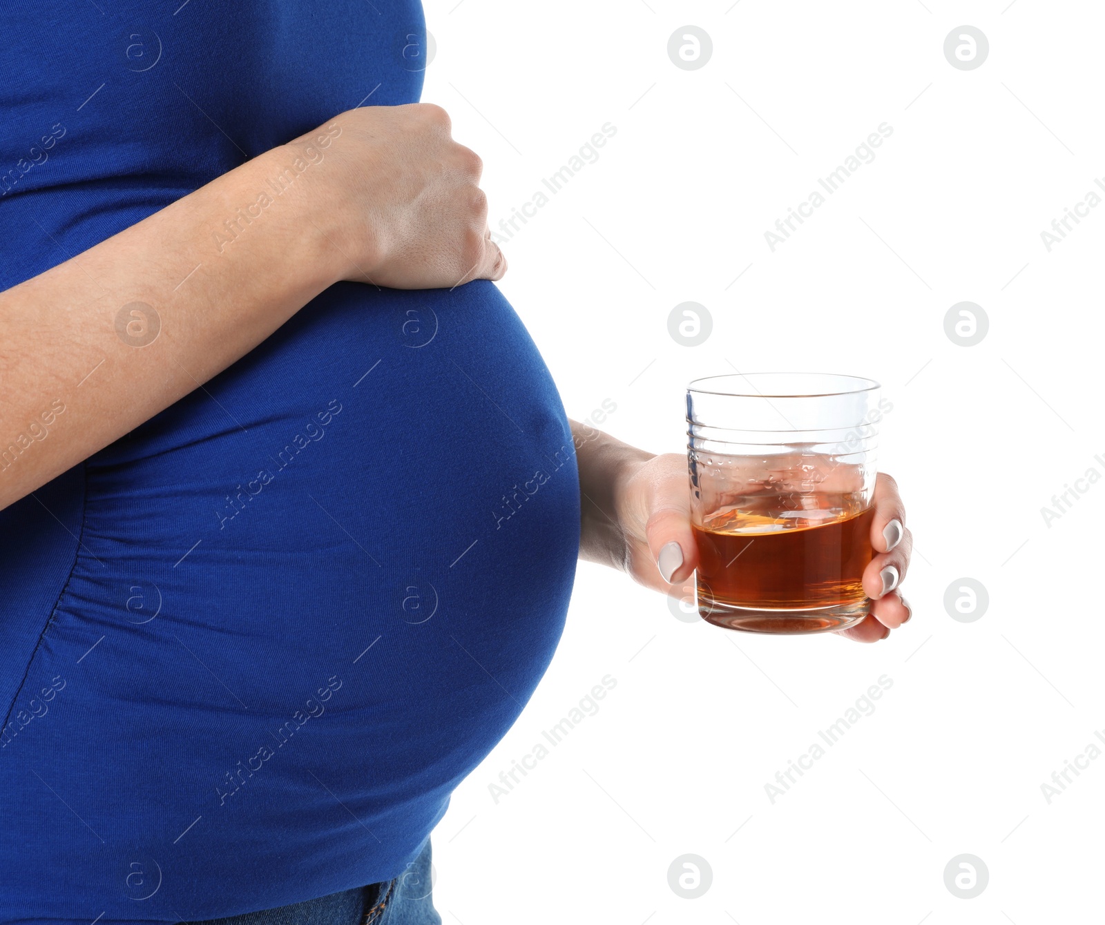 Photo of Future mother with glass of alcohol drink on white background, closeup. Bad habits during pregnancy