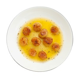 Delicious fried scallops with sauce isolated on white, top view