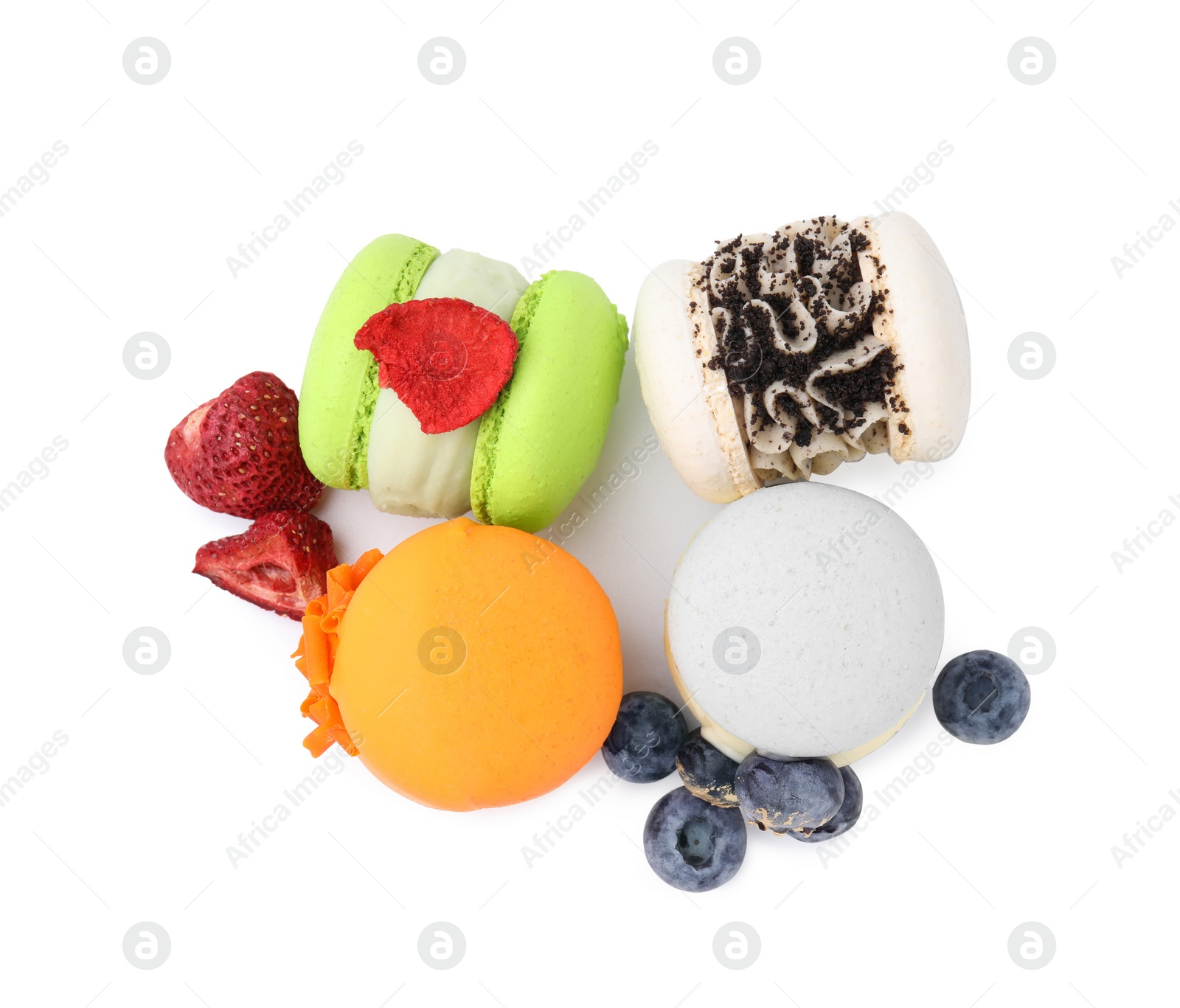 Photo of Delicious macarons and berries isolated on white, top view