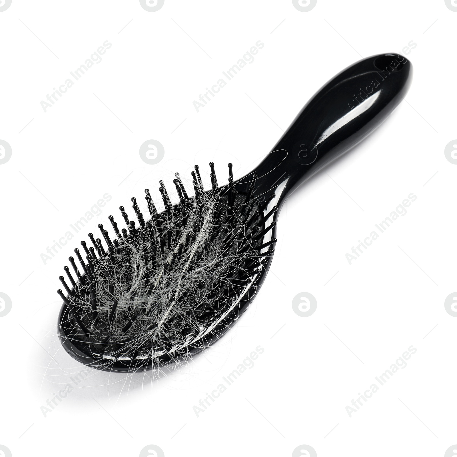 Photo of Brush with lost hair isolated on white