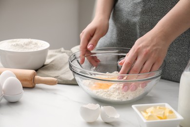 Preparing tasty baklava. Woman making dough at white marble table, closeup