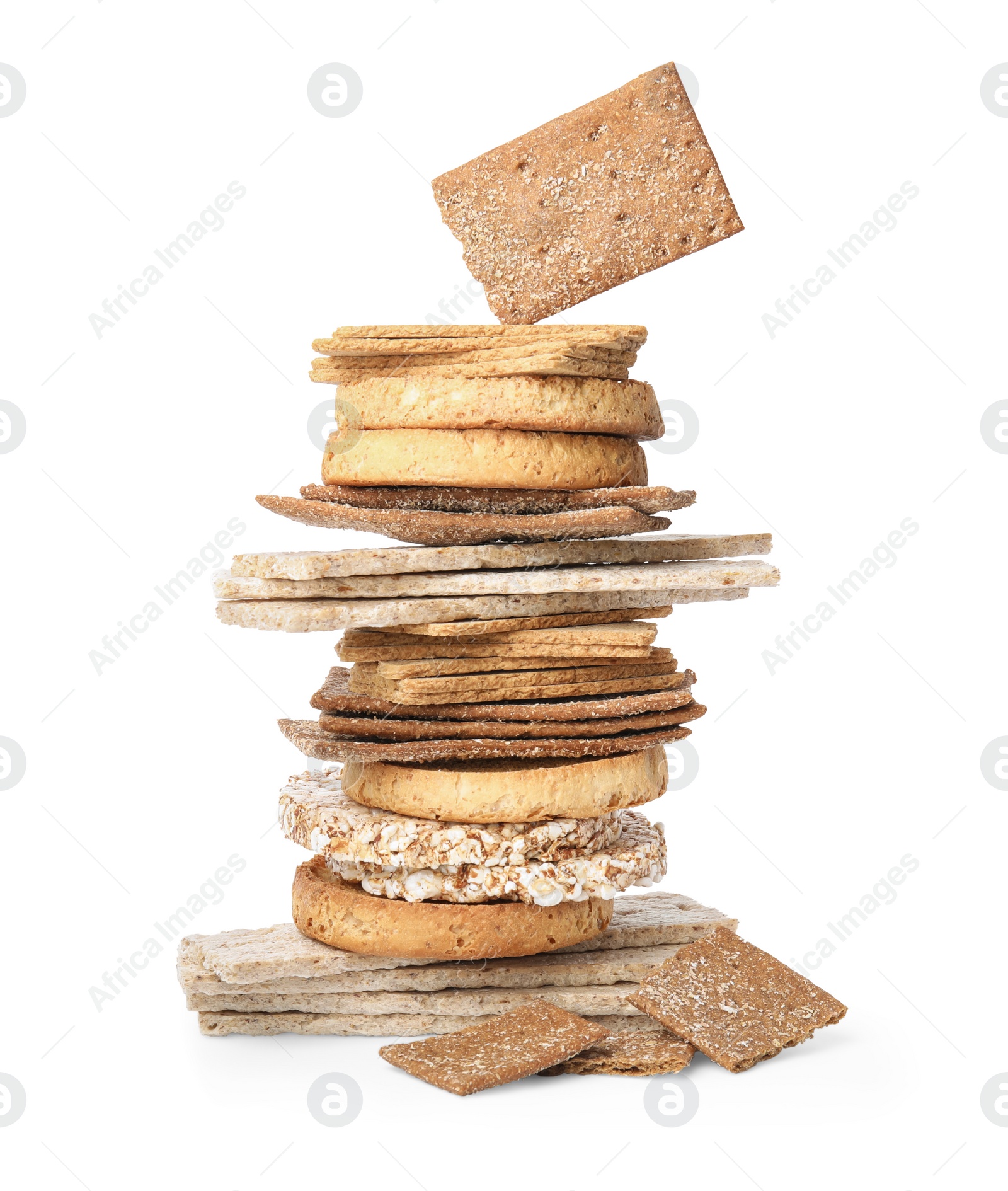 Photo of Stack of fresh rye crispbreads, crunchy rice cakes and rusks on white background