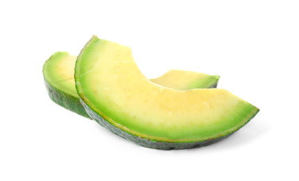 Photo of Slices of raw avocado isolated on white