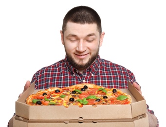 Attractive young man with delicious pizza on white background