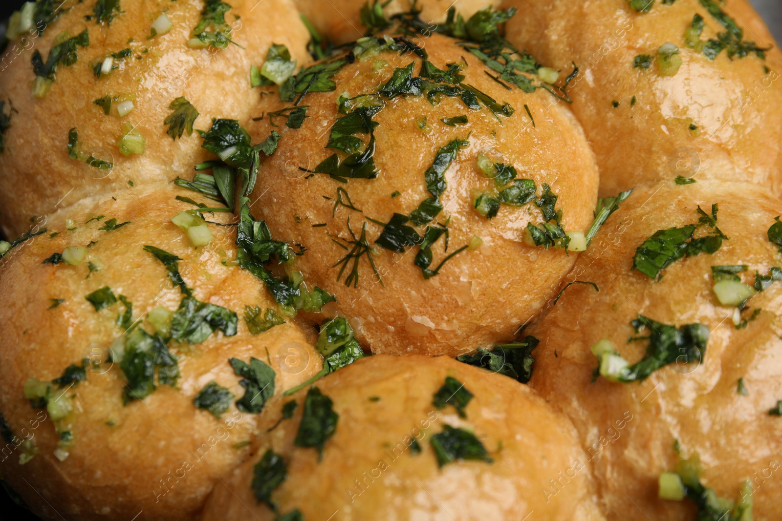 Photo of Traditional pampushka buns with garlic and herbs, closeup