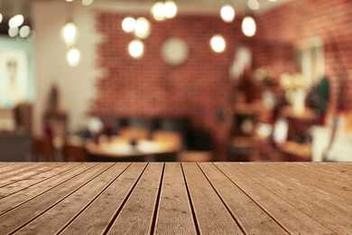 Empty wooden surface in cafe. Space for design