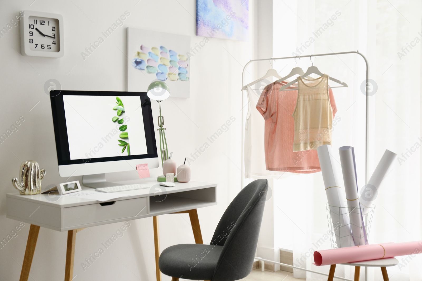 Photo of Designer's workplace with modern computer on table