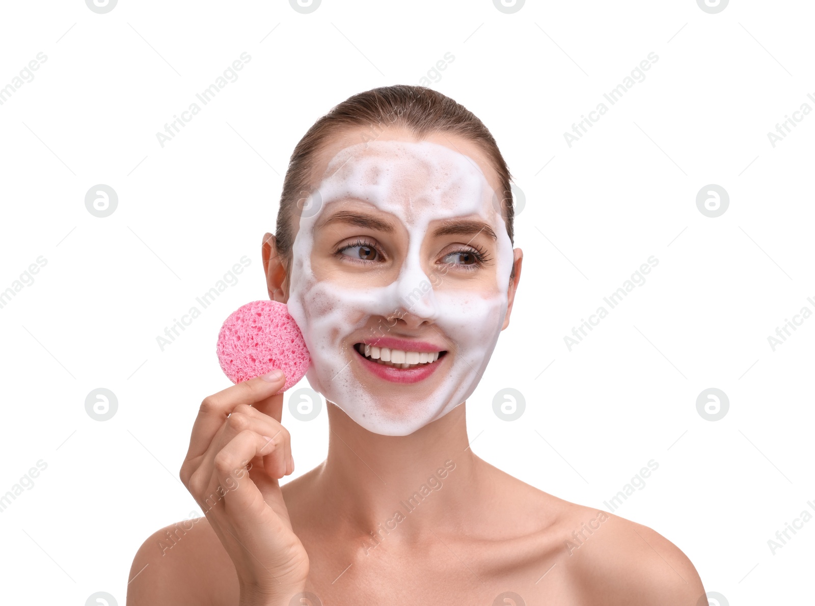 Photo of Happy young woman washing her face with sponge on white background
