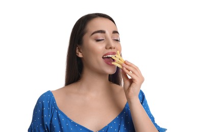 Photo of Beautiful young woman eating French fries on white background