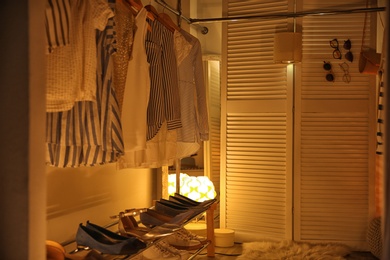 Photo of Modern dressing room with different stylish clothes and accessories