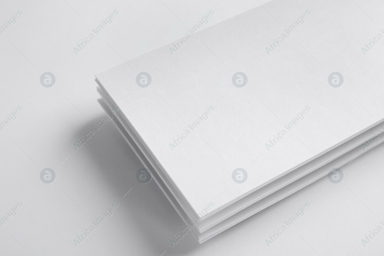 Photo of Blank palm cards on white background. Mock up for design