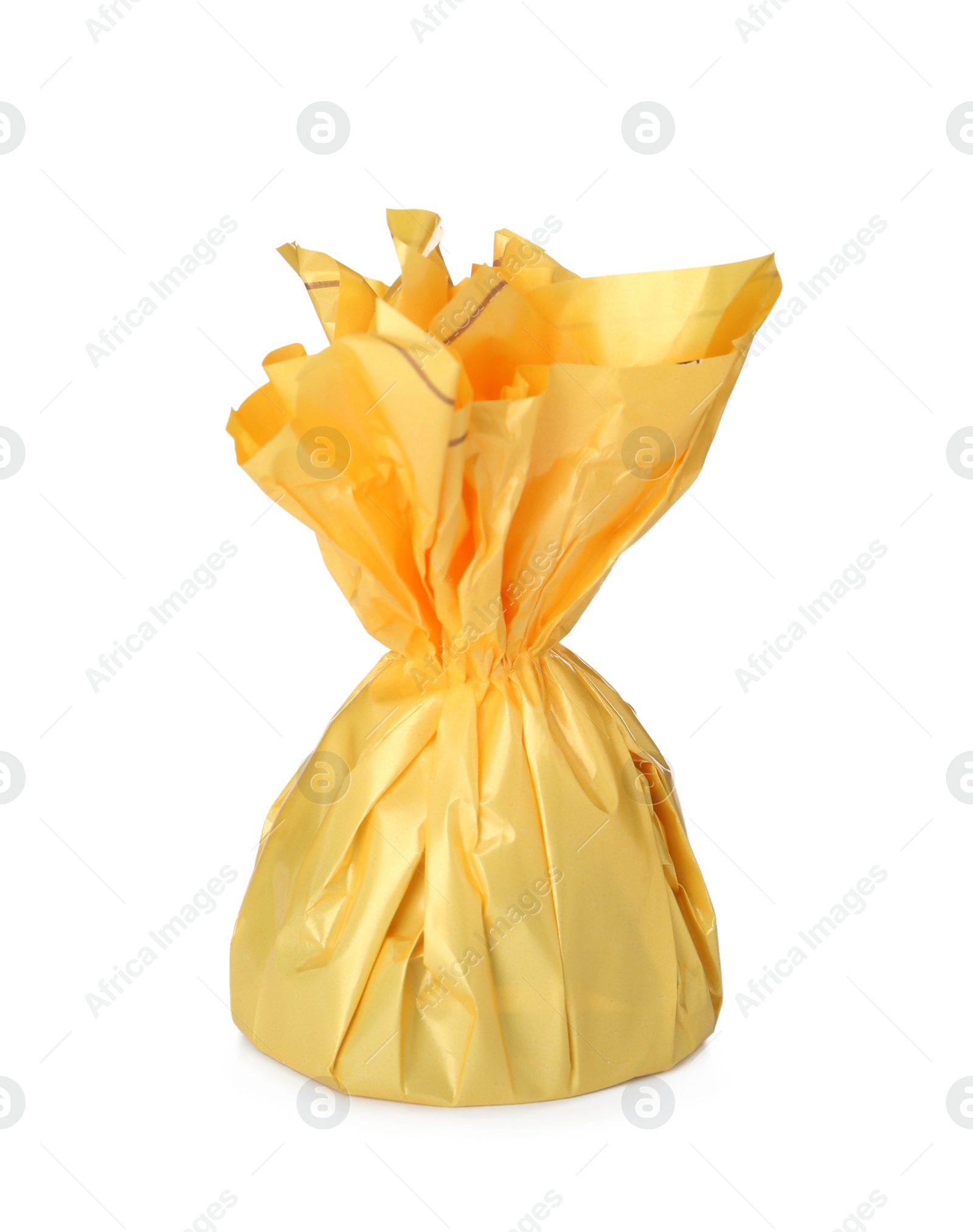 Photo of Delicious candy in yellow wrapper isolated on white