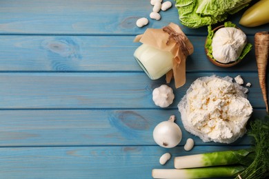 Different fresh farm products on blue wooden table, flat lay. Space for text